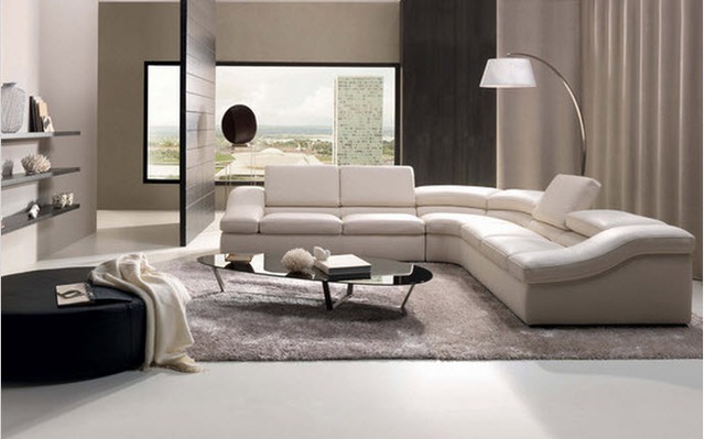 Một tấm thảm bằng chất liệu lông mềm mại, thiết kế đẹp mắt có khả năng biến không gian phòng khách thành một nơi vô cùng hiện đại và ấm cúng.