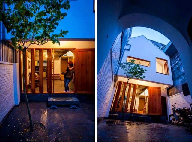 Kiến trúc sư đã hiện thực hóa ý tưởng của chủ nhà với việc thiết kế cổng vào dạng cánh vòm mang phong cách dân dã của Hà Nội xưa.