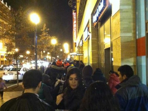 Here's a ton of people waiting in line that snakes out of a D.C. Target. They're all bundled up.